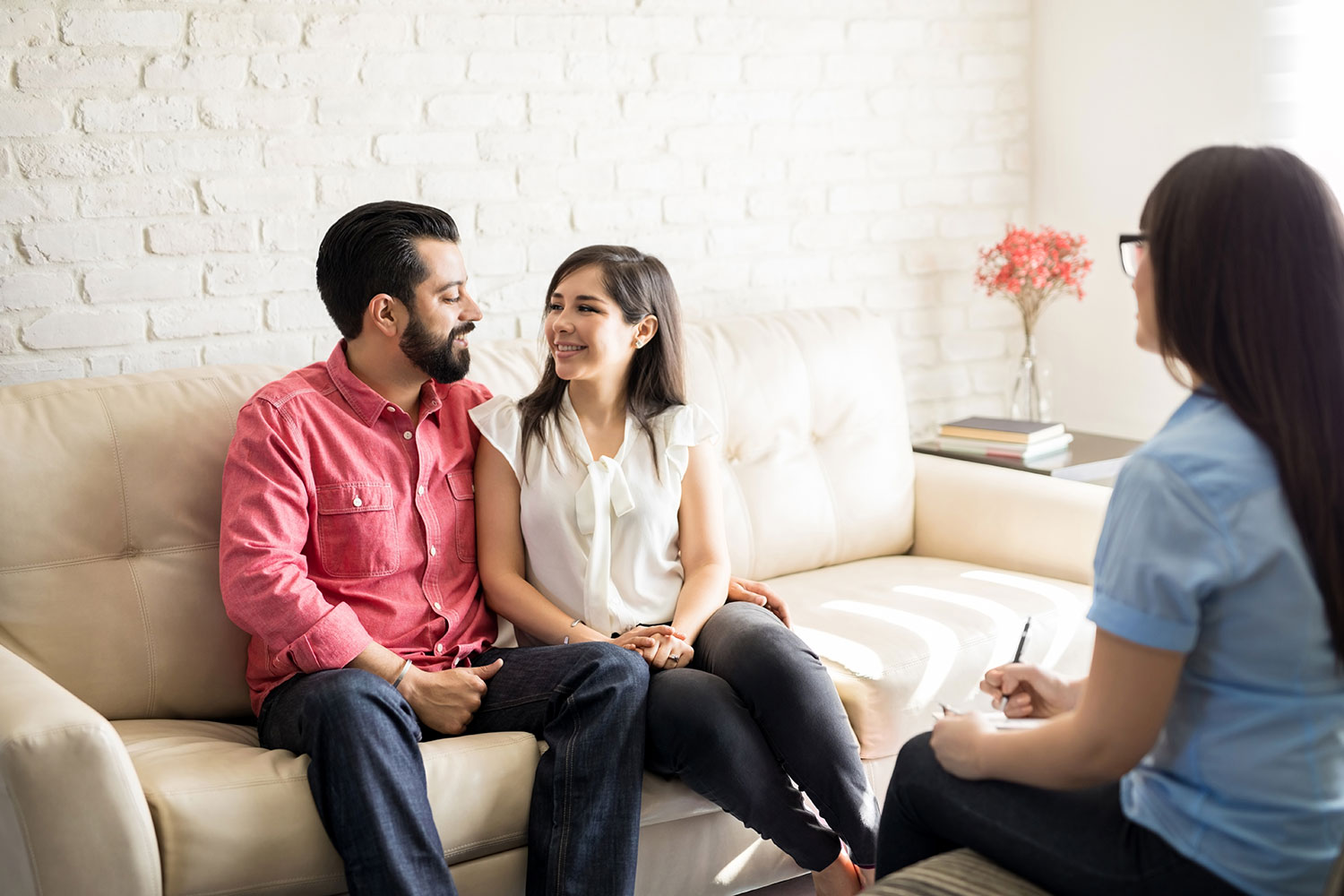 A married couple smiles at one another during a Buckhead marriage counseling session.