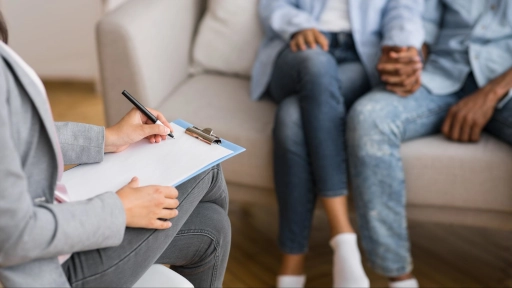 a counselor writing in a sheet pad