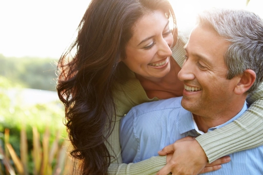 a man and woman cuddling happily