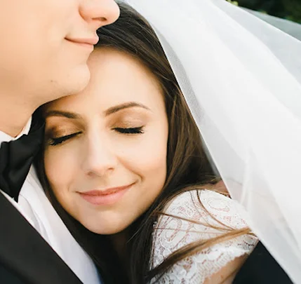 Bride and groom embrace