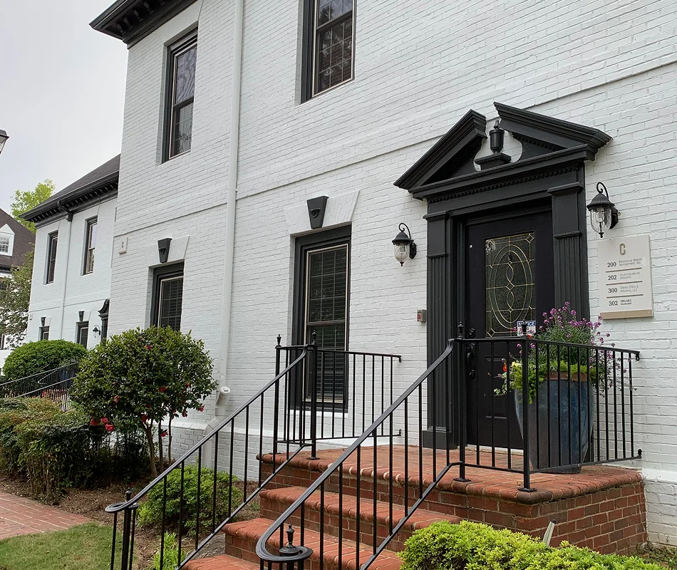 Exterior of a white brick building