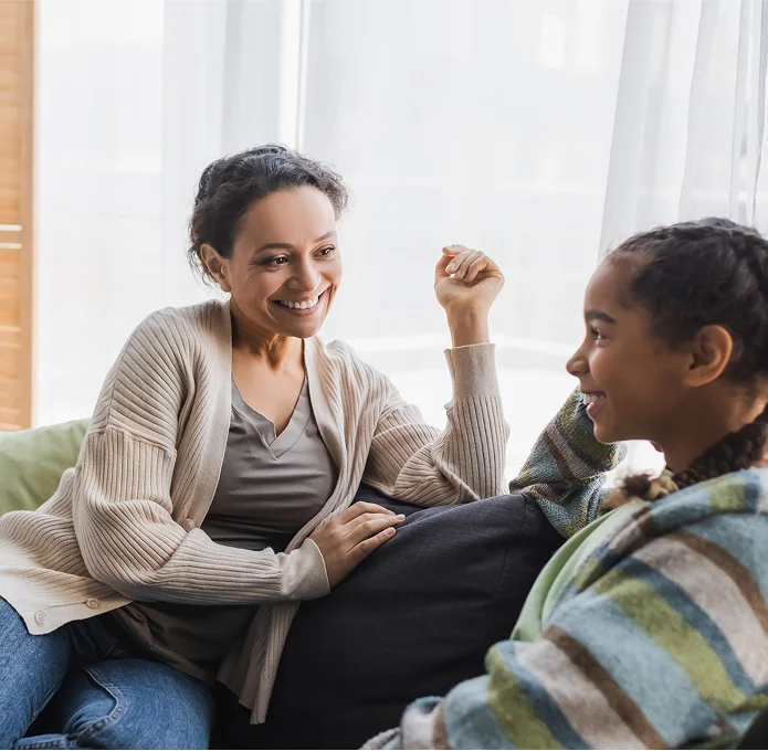 Woman and child talking on couch