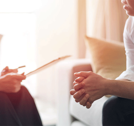 individual-therapy-buckhead Couple talking on couch