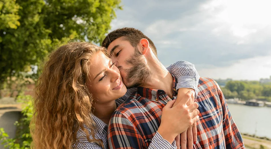 Couple kissing outdoors